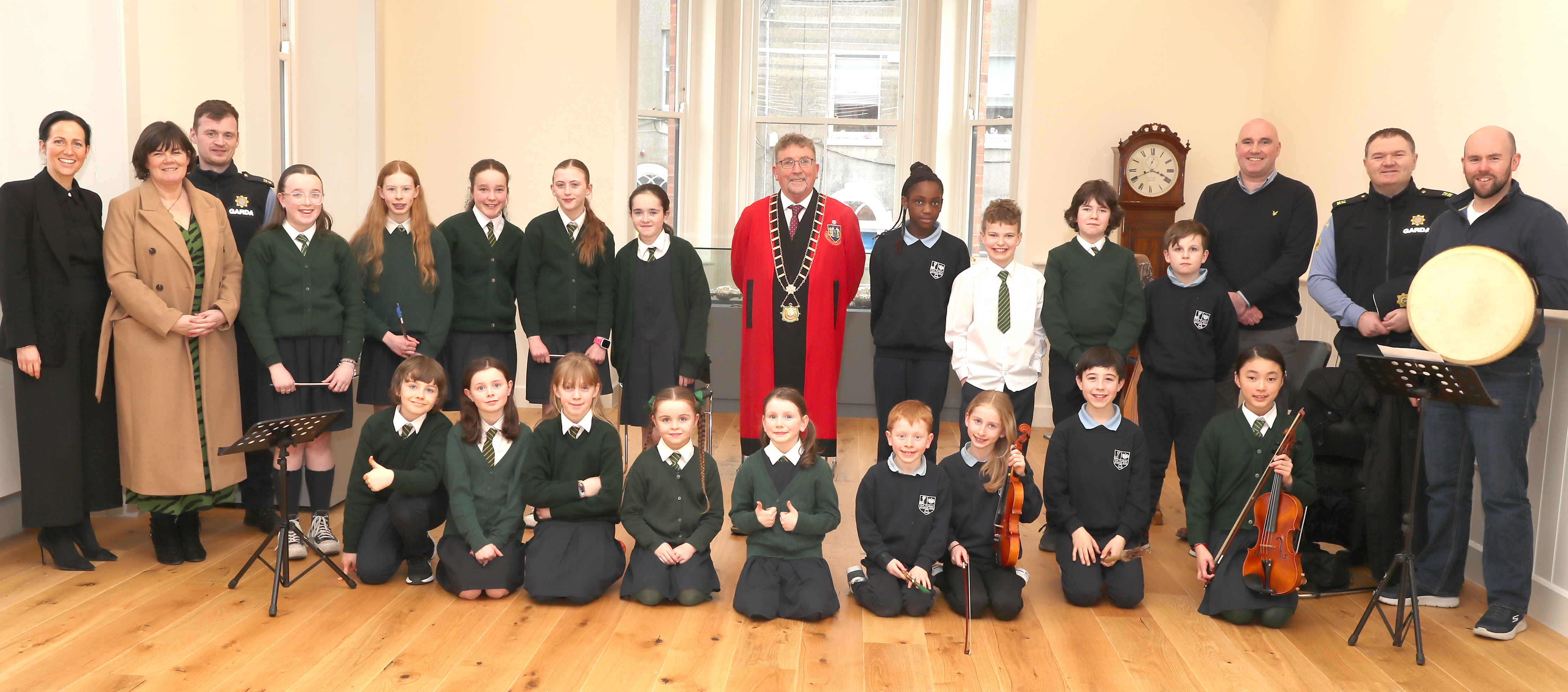 Students and teachers from Scoil Aonghusa, Drogheda, pictured with members of An Garda Siochana, Cllr Paddy McQuillan, Mayor of Drogheda, and Cllrs Michelle Hall and James Byrne at the Seachtain na Gaeilge event at the Civic Offices in Drogheda