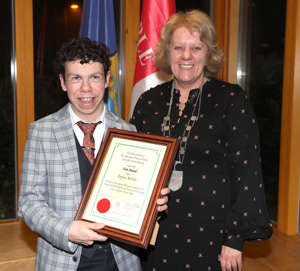 Eoghan McCabe accepts the award from Cathaoirleach of Ardee Municipal District, Paula Butterly. thumbnail